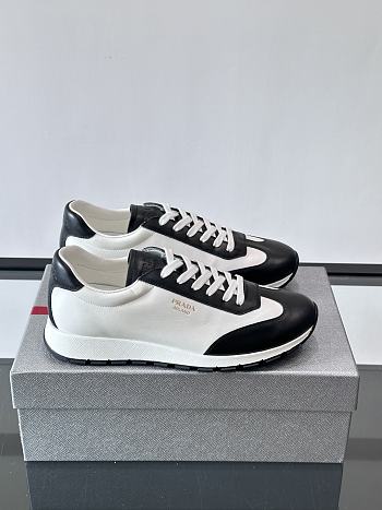 Bagsaaa Prada Downtown low-top sneakers in white and black