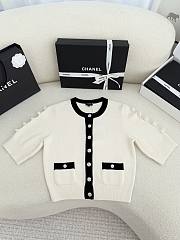 Bagsaaa Chanel cardigan in a white knit with black trim and pearl buttons - 1