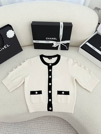 Bagsaaa Chanel cardigan in a white knit with black trim and pearl buttons