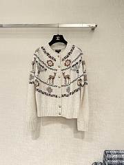 Bagsaaa Chanel cardigan featuring a winter-themed - 1