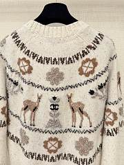 Bagsaaa Chanel cardigan featuring a winter-themed - 4