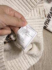 Bagsaaa Chanel cardigan featuring a winter-themed - 3