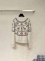 Bagsaaa Chanel cardigan featuring a winter-themed - 2