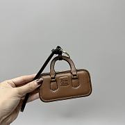 Bagsaaa Miu Miu Trick Arcadie leather keychain charm in a brown - 1