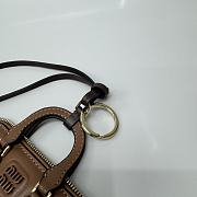 Bagsaaa Miu Miu Trick Arcadie leather keychain charm in a brown - 2