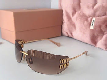 Bagsaaa Miu Miu rimless sunglasses feature gold-tone metal frames